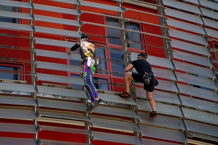 Alain Robert, the free climber dubbed the "French Spiderman", scaled one of Barcelona's highest skyscrapers